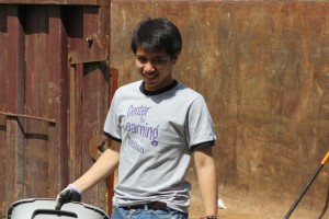 A CLiA representative leads alumni in service work at the Spruces.